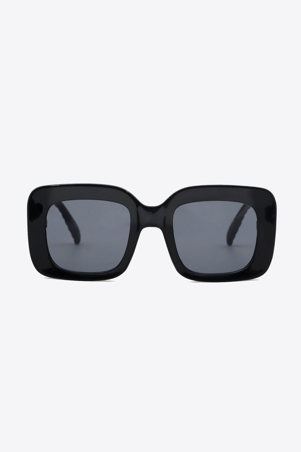 Black square sunglasses with a bold glossy polycarbonate frame, gray lenses, and a wide structured silhouette for a polished finish.