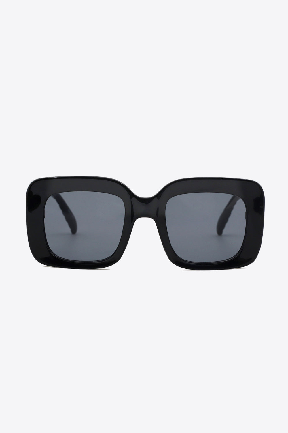 Black square sunglasses with a bold glossy polycarbonate frame, gray lenses, and a wide structured silhouette for a polished finish.
