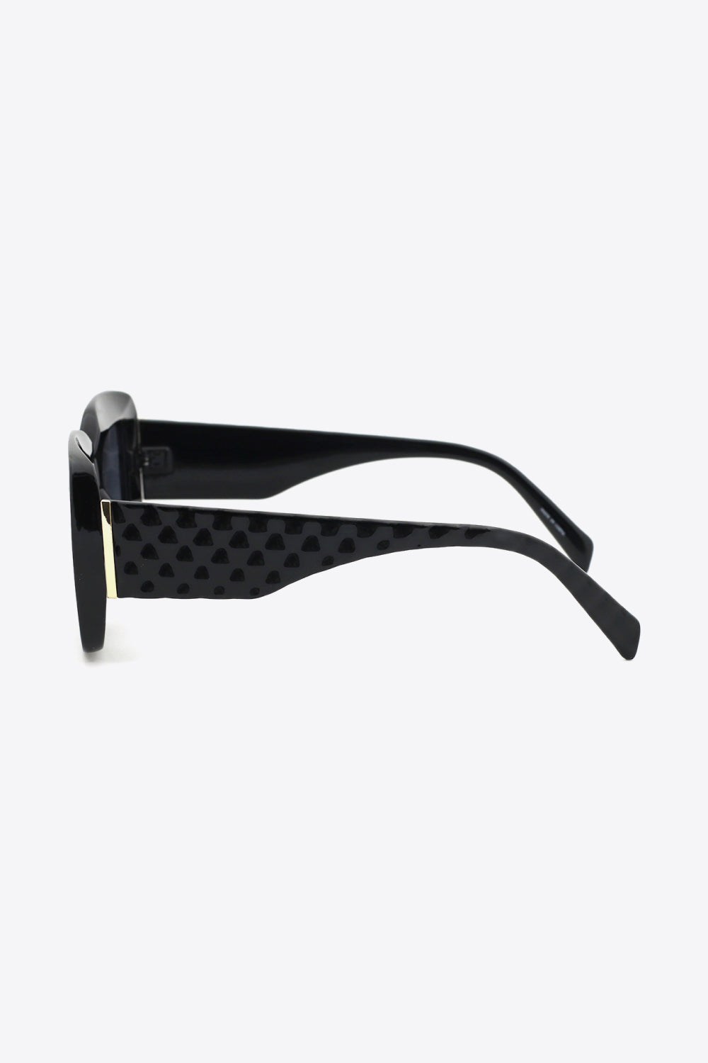 Black square polycarbonate UV400 sunglasses shown in side profile with bold frames, patterned wide temples, and gold-tone hinge accents.