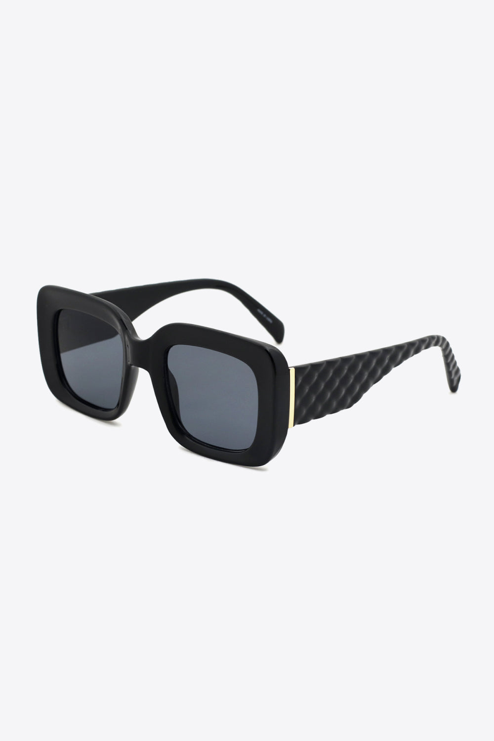 Black square polycarbonate UV400 sunglasses feature oversized frames, dark lenses, rounded corners, textured temples, and subtle gold-tone hinge accents.