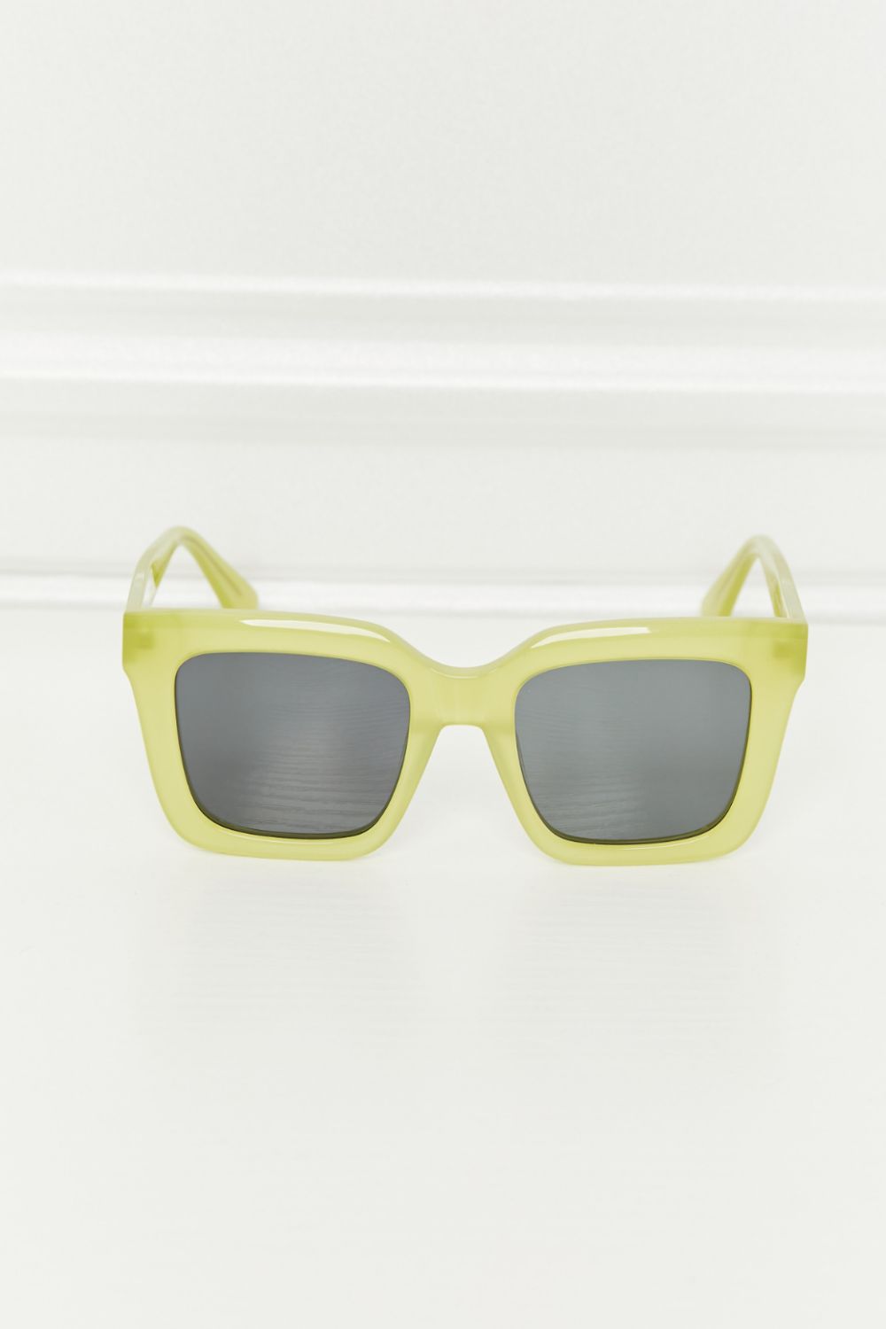 Square sunglasses feature a vivid neon yellow acetate frame, structured retro-inspired silhouette, and contrasting dark TAC polarized lenses with visible temples.