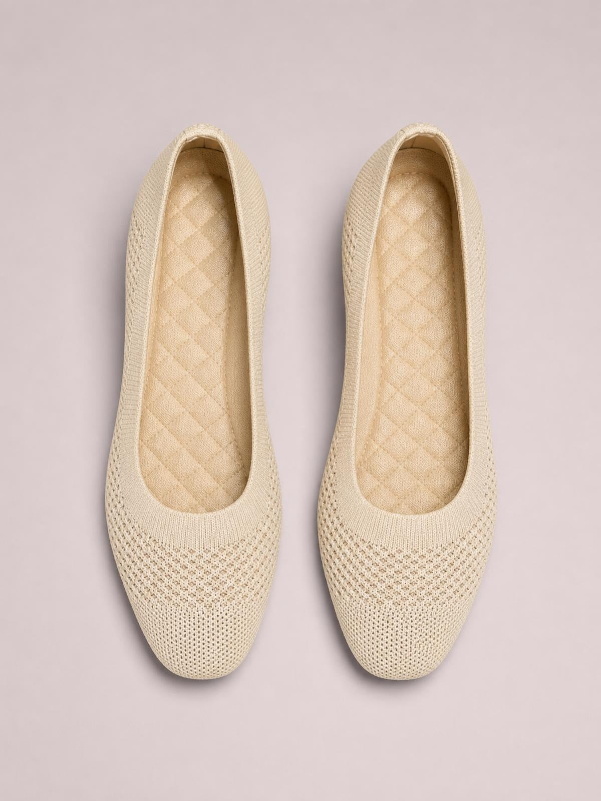 Top-down view of cream solid-color mesh slip-ons with a square-toe silhouette, woven construction, cushioned insoles, and flat profiles.