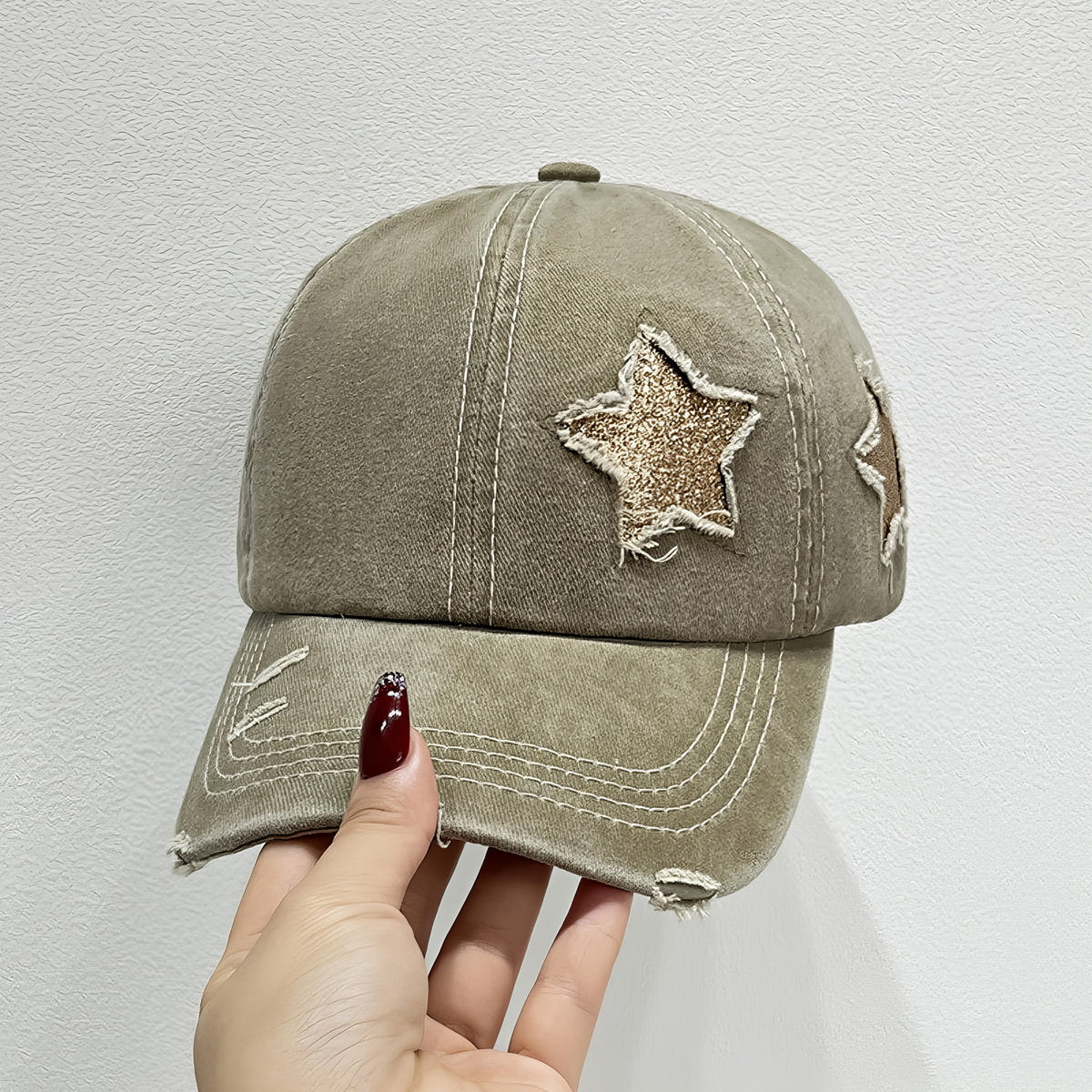 Khaki Star Adjustable Baseball Cap with a softly structured six-panel crown, curved brim, contrast stitching, star appliqués, and distressed edging.