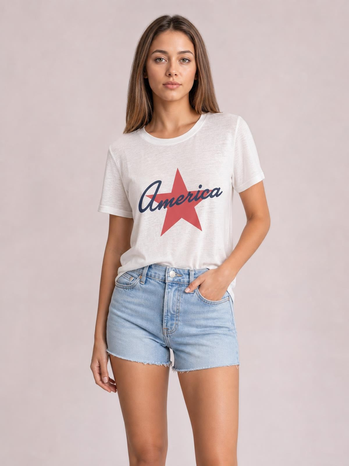 Model wears a white Star round-neck short-sleeve T-shirt with a red star graphic, casual relaxed silhouette, and slightly loose construction.