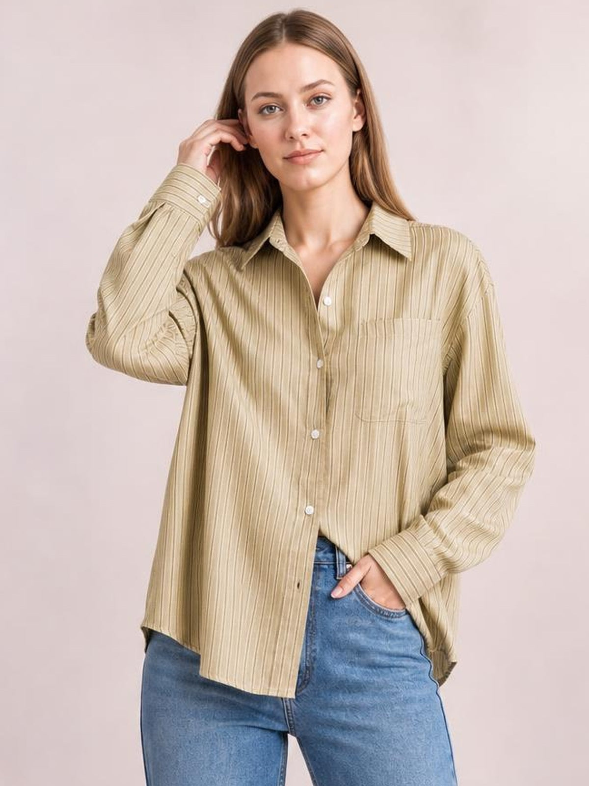Model wears a relaxed beige striped button-up long sleeve shirt with a pointed collar, buttoned chest pocket, and straight hem.
