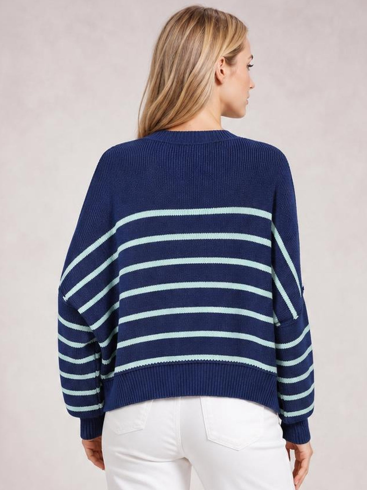 Model shown from behind wearing a navy striped pullover sweater with a round neck, dropped shoulders, long lantern sleeves, ribbed cuffs and hem, and a relaxed regular silhouette.