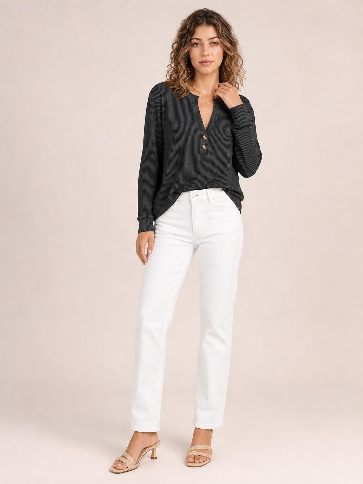 A model wears a dark charcoal striped long sleeve T-shirt with a notched neckline, two button accents, and a relaxed silhouette, touching the collar.