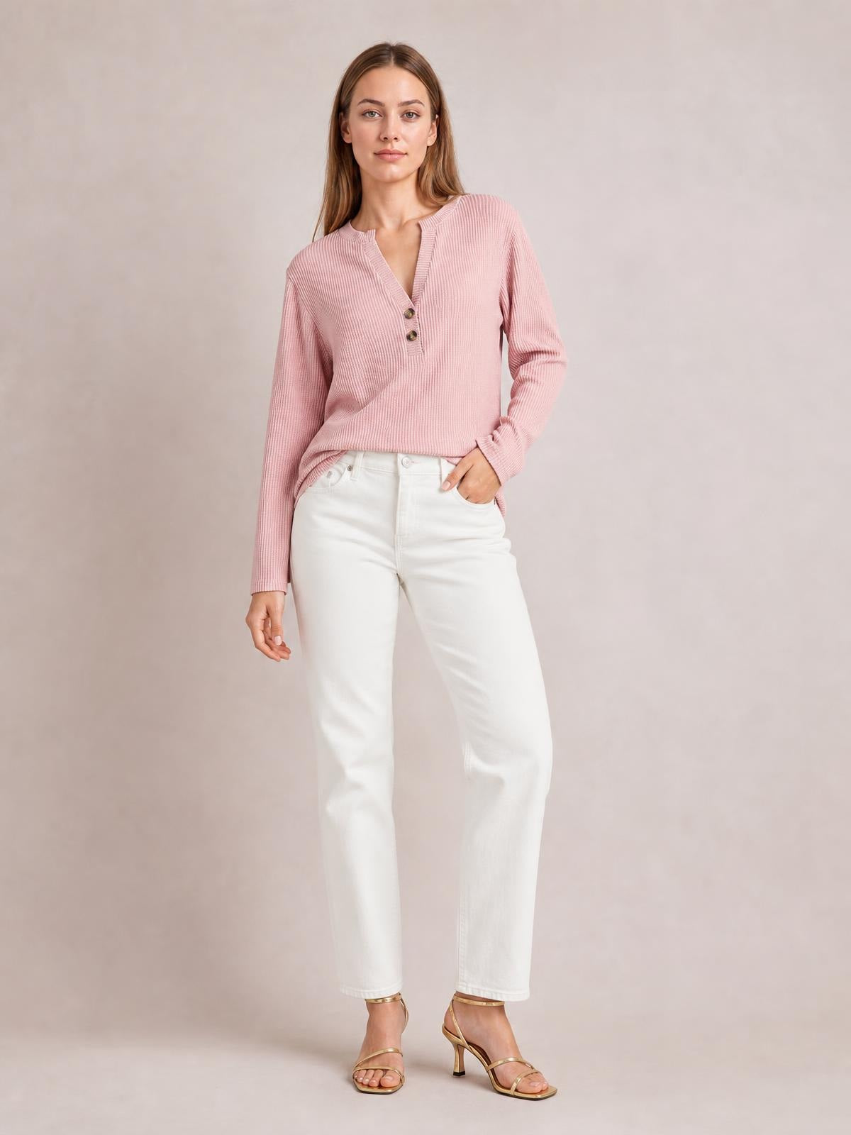 Model wears a pink striped long sleeve T-shirt with a notched V-neck, button accents, ribbed texture, and a relaxed silhouette.