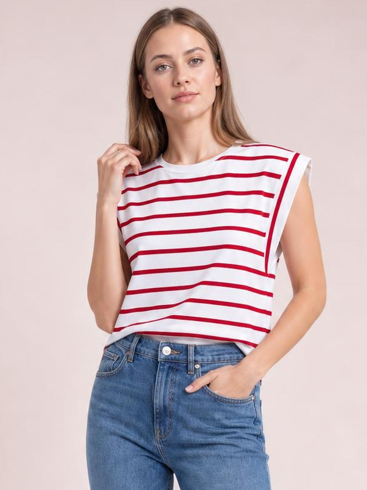 Model poses in a white striped round neck cap sleeve T-shirt with red horizontal stripes, a relaxed silhouette, and contrast armhole trim.