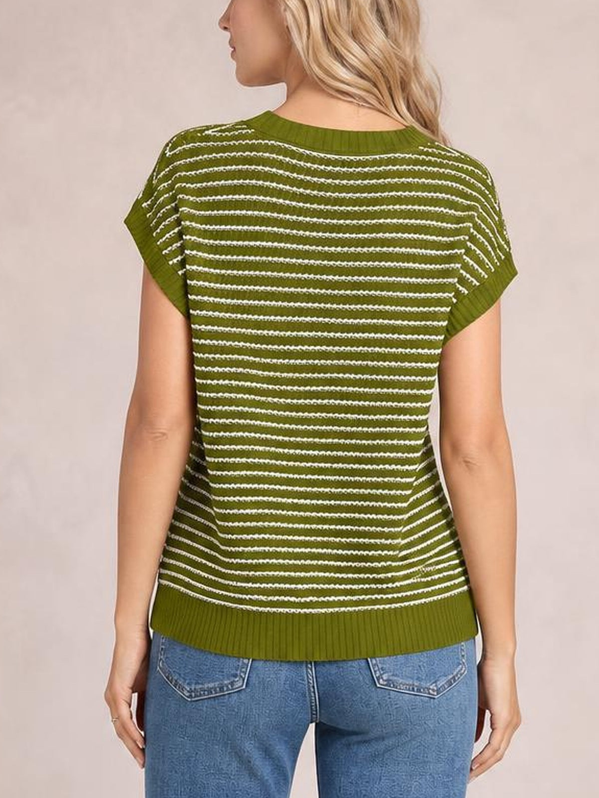 Back view of a model wearing an olive green striped round neck short sleeve knit top with a straight silhouette and ribbed neckline and hem.