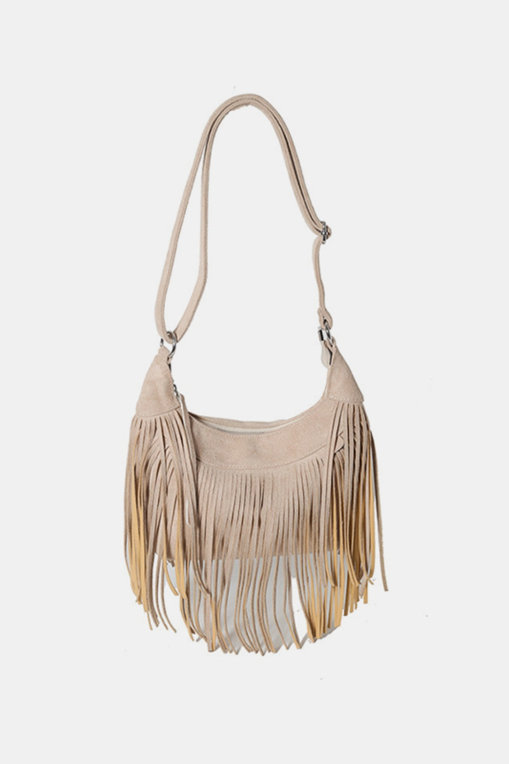 Small beige suede fringe shoulder bag with a softly curved silhouette, long layered fringe, and an adjustable strap with metal hardware.