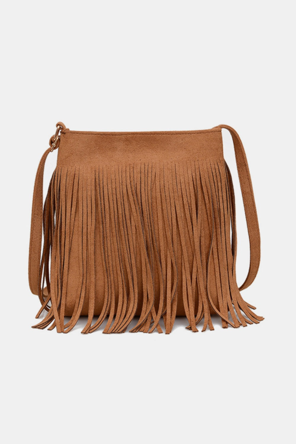 A small tan suede fringe shoulder bag features a softly structured rectangular silhouette, long fluid fringe, and a slender shoulder strap.