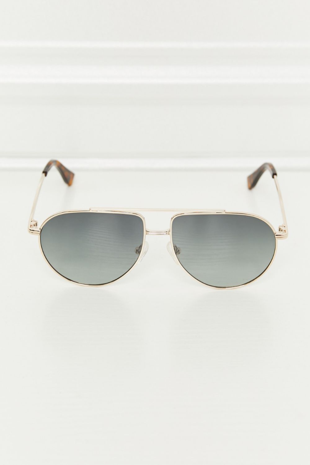 Dark gray TAC polarization lens aviator sunglasses feature a streamlined metal frame, rounded teardrop lenses, and acetate-and-metal temples in a front-facing view.