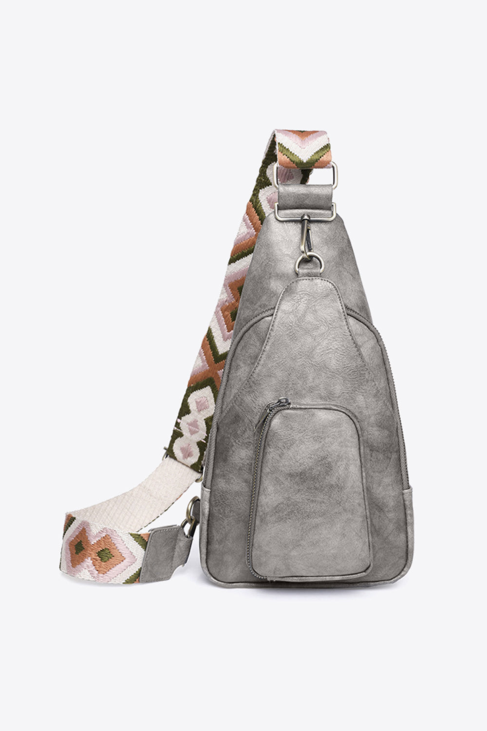 A compact gray PU leather sling bag with a streamlined silhouette, broad patterned shoulder strap, silver-tone hardware, and a front zip pocket.