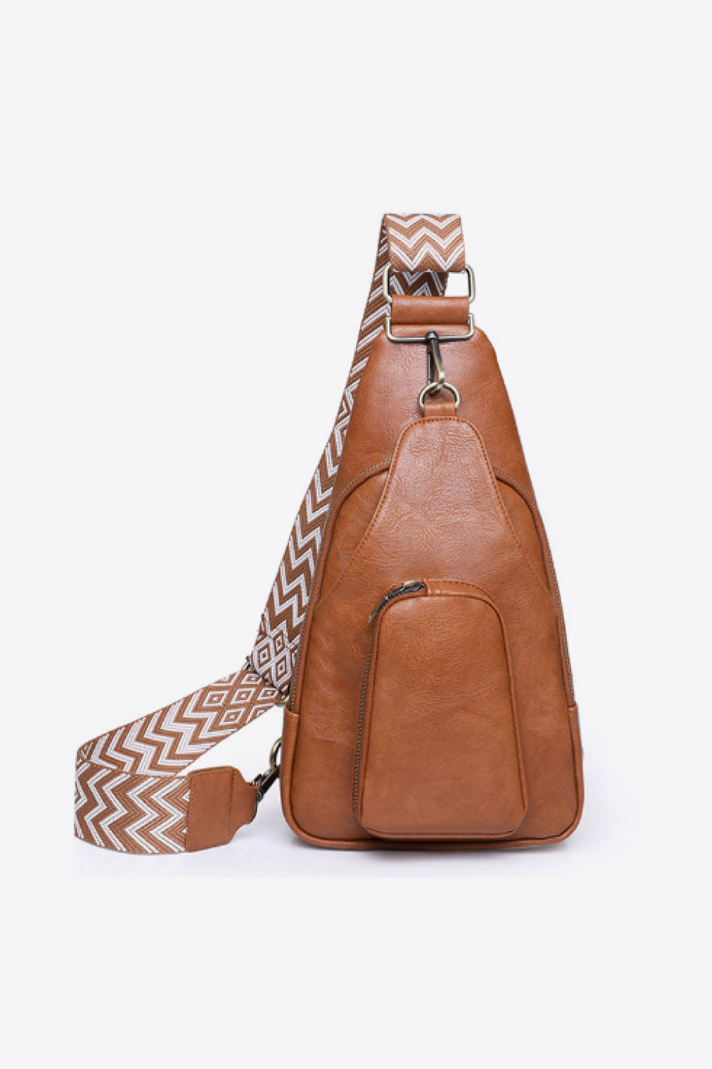 Brown PU leather sling bag with a compact tapered silhouette, front zip pocket, polished hardware, and a broad geometric-patterned shoulder strap.