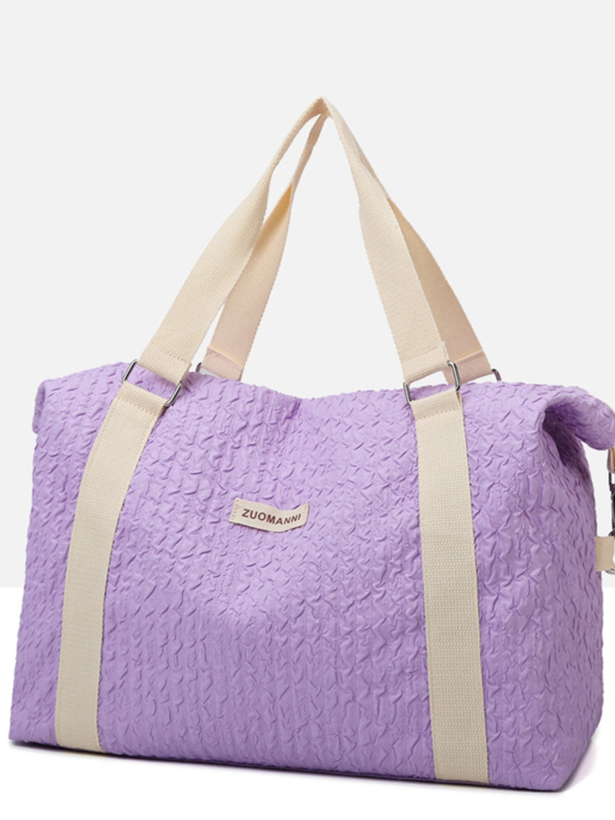 Large lavender textured Oxford cloth travel bag with a softly structured silhouette, wide beige top handles, and adjustable metal hardware.