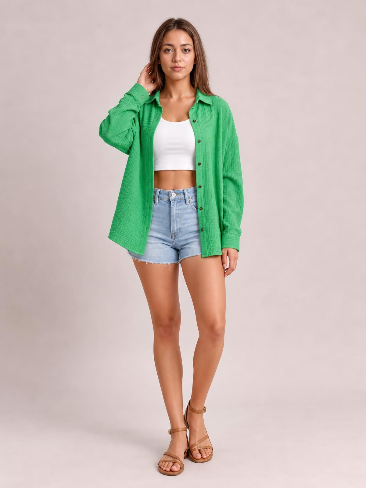 Model wears a bright green textured dropped shoulder longline shirt with a collared neckline, button front, long sleeves, and relaxed silhouette.