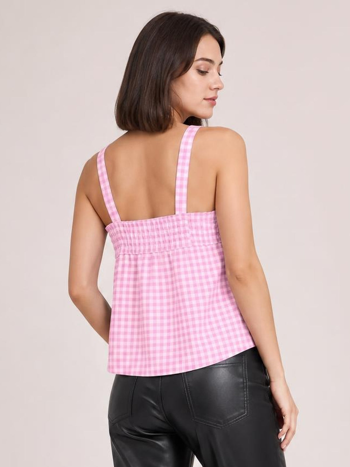 Model shown from behind wearing a pink textured gingham cami with wide straps, a square back neckline, gathered seams, and a relaxed silhouette.