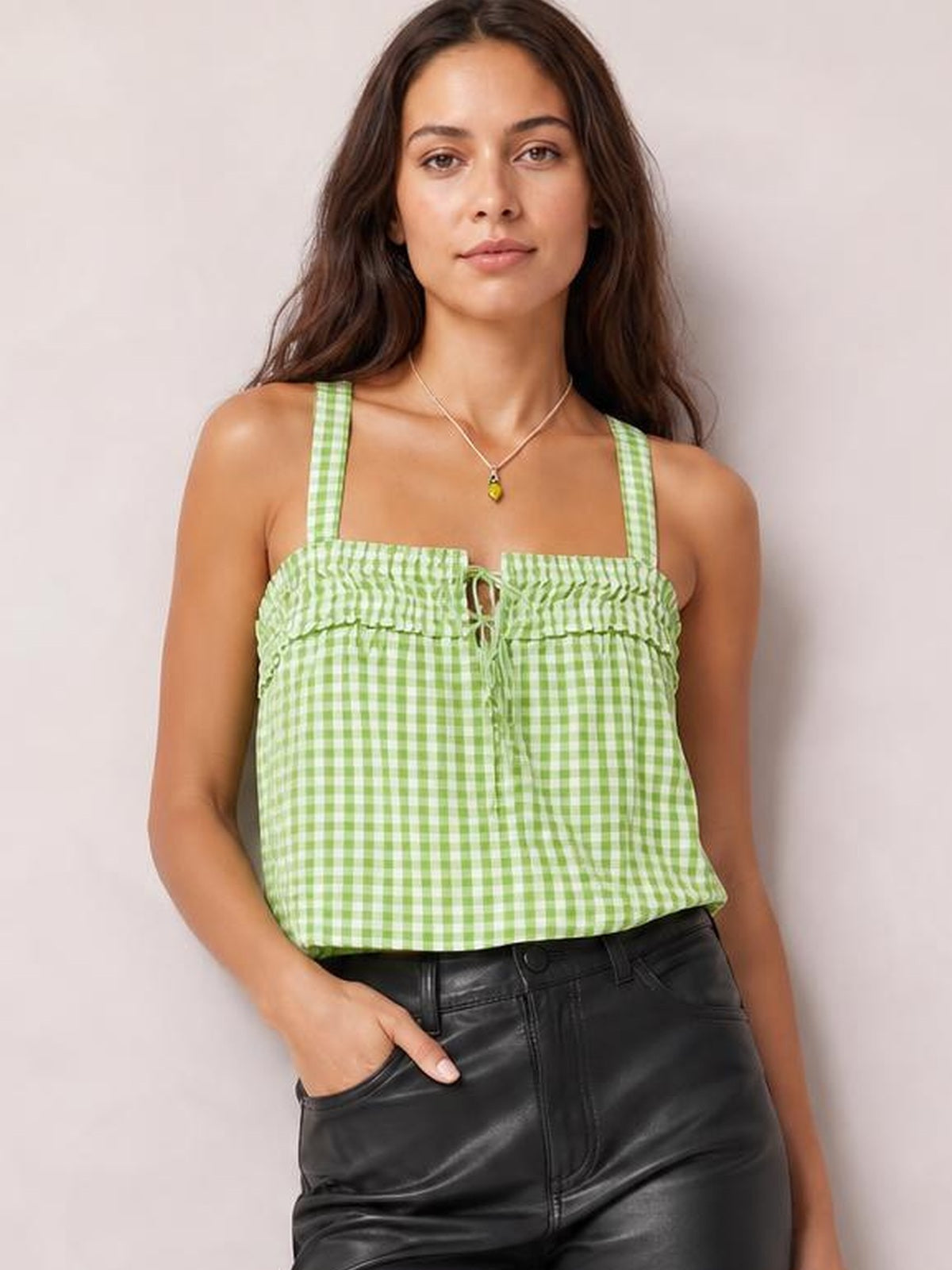 Model wearing a green-and-white textured square neck cami with wide straps, ruched detailing, front tie, and a relaxed straight silhouette.