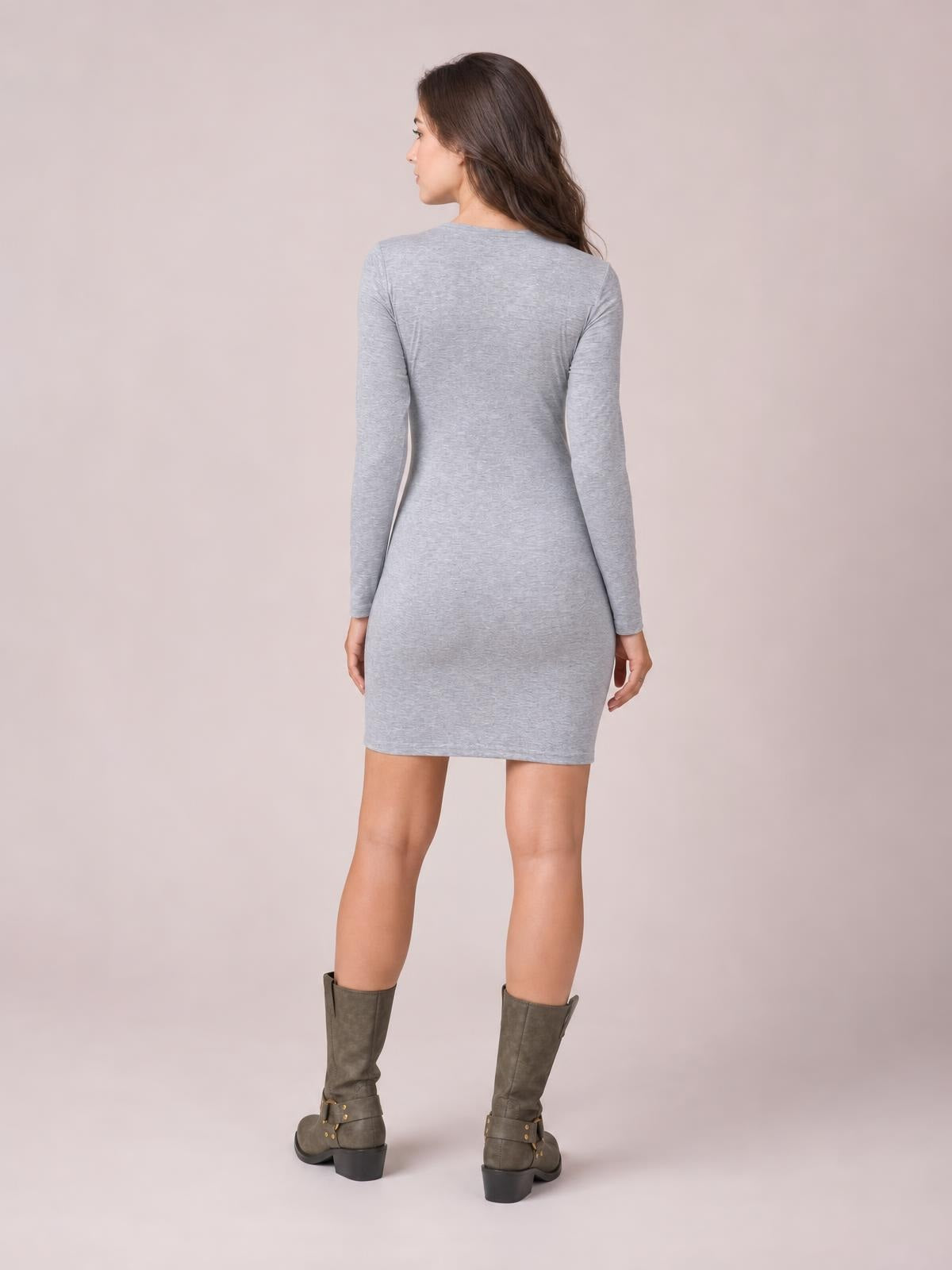 Model shown from the back in a light gray tied round-neck mini dress with long sleeves, a fitted silhouette, and straight hem.
