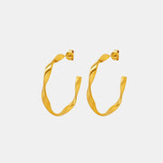 Gold-tone 18K gold-plated titanium steel C-hoop earrings feature a sculpted, gently twisted silhouette with smooth polished construction and butterfly backs.