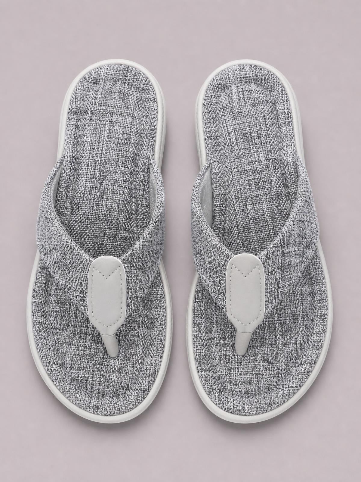 Gray heathered toe post sandals with textured footbeds, V-shaped straps, white rubber soles, and flat construction.