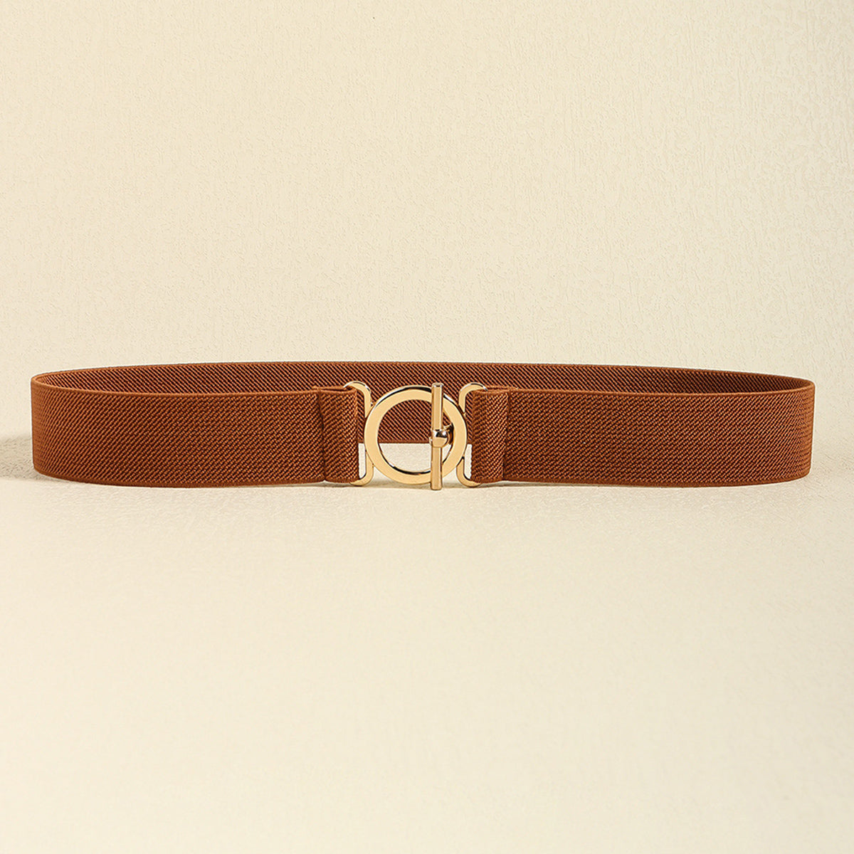 Brown 1.2-inch Toggle Clasp Elastic Belt with a streamlined band and centered gold-tone circular toggle clasp.