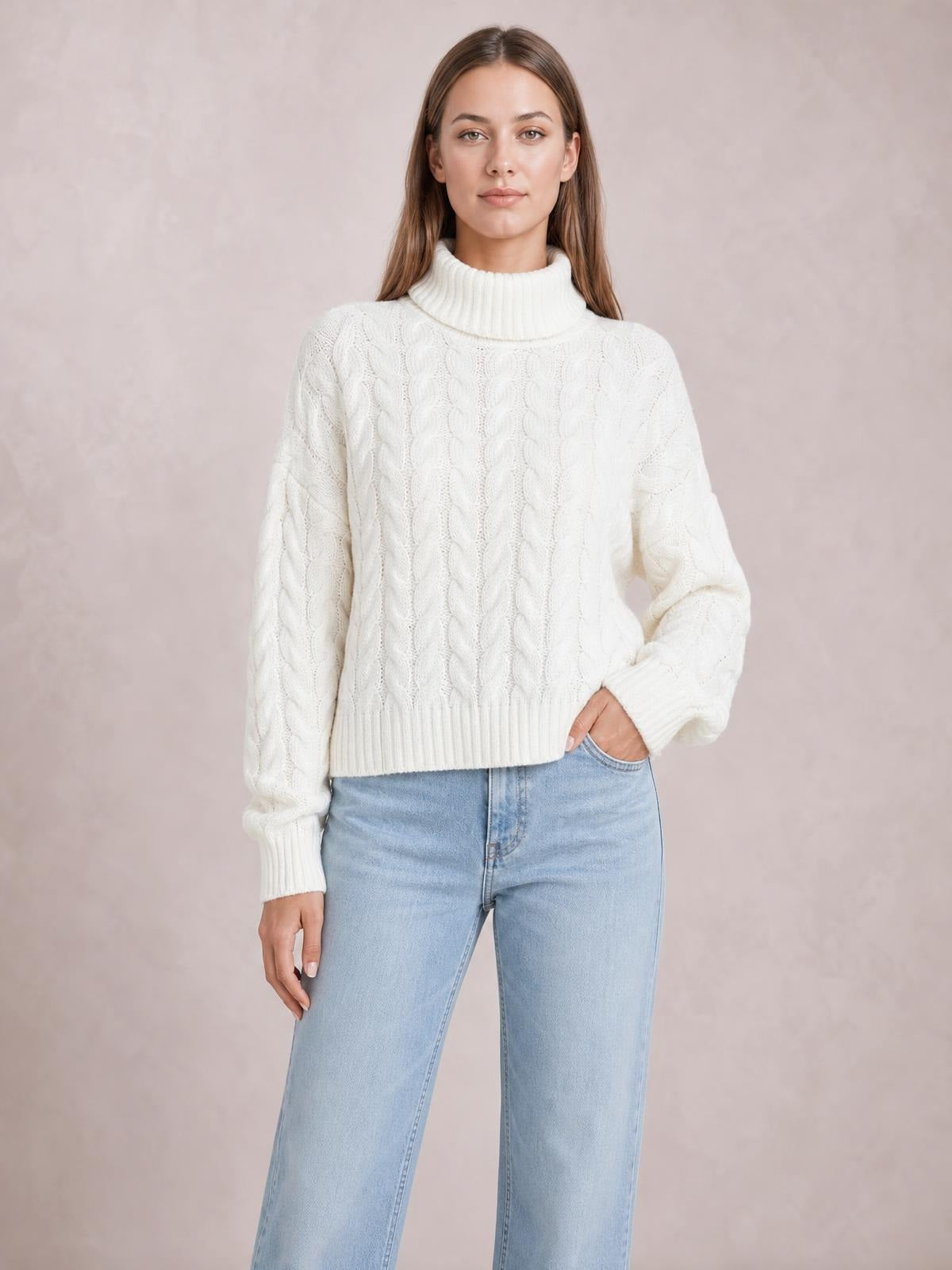 Model wearing a white cable-knit turtleneck sweater with long regular sleeves, ribbed cuffs and hem, and a relaxed regular-length silhouette.