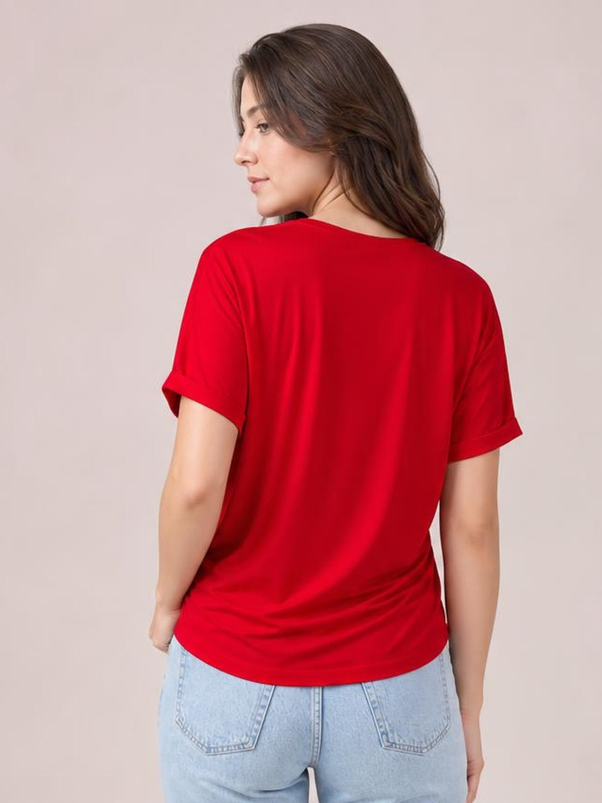 Model shown from behind in a red crewneck T-shirt with short rolled sleeves, a relaxed silhouette, and a straight hem.