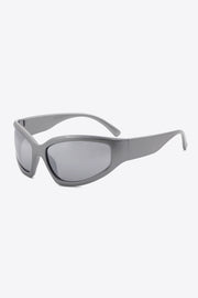 Mid gray UV400 polycarbonate cat-eye sunglasses feature softly curved frames, subtle gray-tinted lenses, and wide streamlined temples for a bold silhouette.