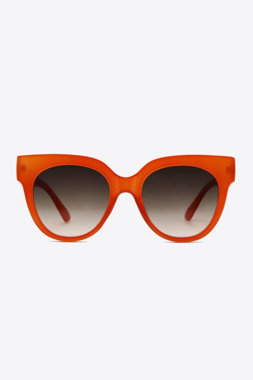 Round UV400 sunglasses feature a bold translucent deep red polycarbonate frame, softly curved silhouette, and gradient-toned lenses for a polished retro-inspired look.