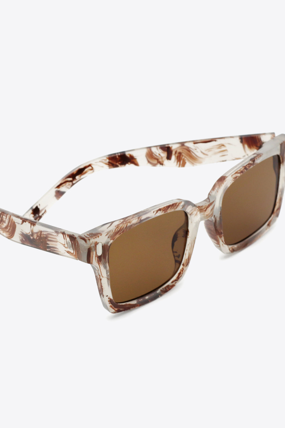 UV400 polycarbonate square sunglasses feature softly rounded brown lenses and substantial translucent cream-and-brown marbled frames with defined temples.