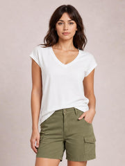 Model wearing a white V-neck short sleeve T-shirt with a relaxed silhouette and clean basic construction, paired with olive cargo shorts.