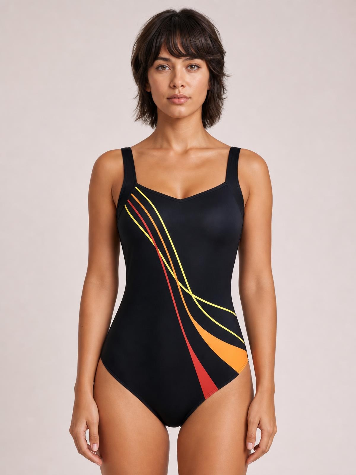 Model stands facing forward in a black sleeveless one-piece swimsuit with a V-neckline, fitted silhouette, and colorful curved stripe print.