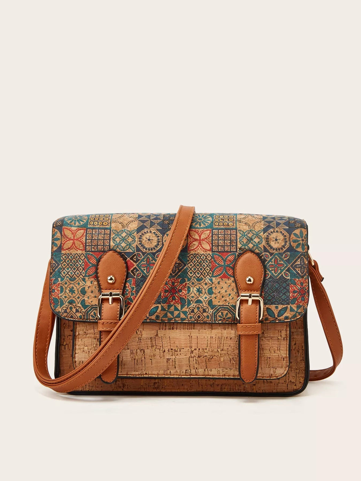 Medium vintage-pattern PU leather crossbody bag with a structured rectangular silhouette, colorful geometric panels, tan shoulder strap, and buckle accents.