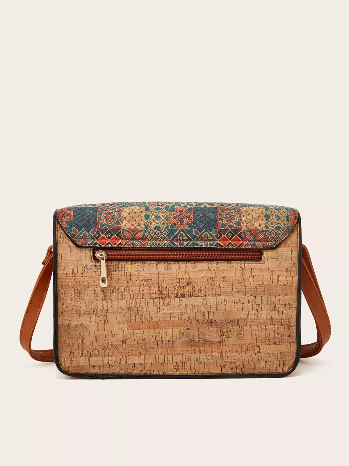 Medium tan PU leather crossbody bag with a vintage multicolor patterned flap, front zip pocket, structured rectangular silhouette, and brown shoulder strap.