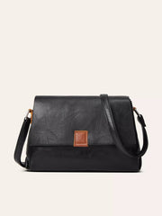 Vintage black PU leather crossbody bag with a structured rectangular silhouette, wide flap closure, adjustable shoulder strap, and brown stitched tab detail.