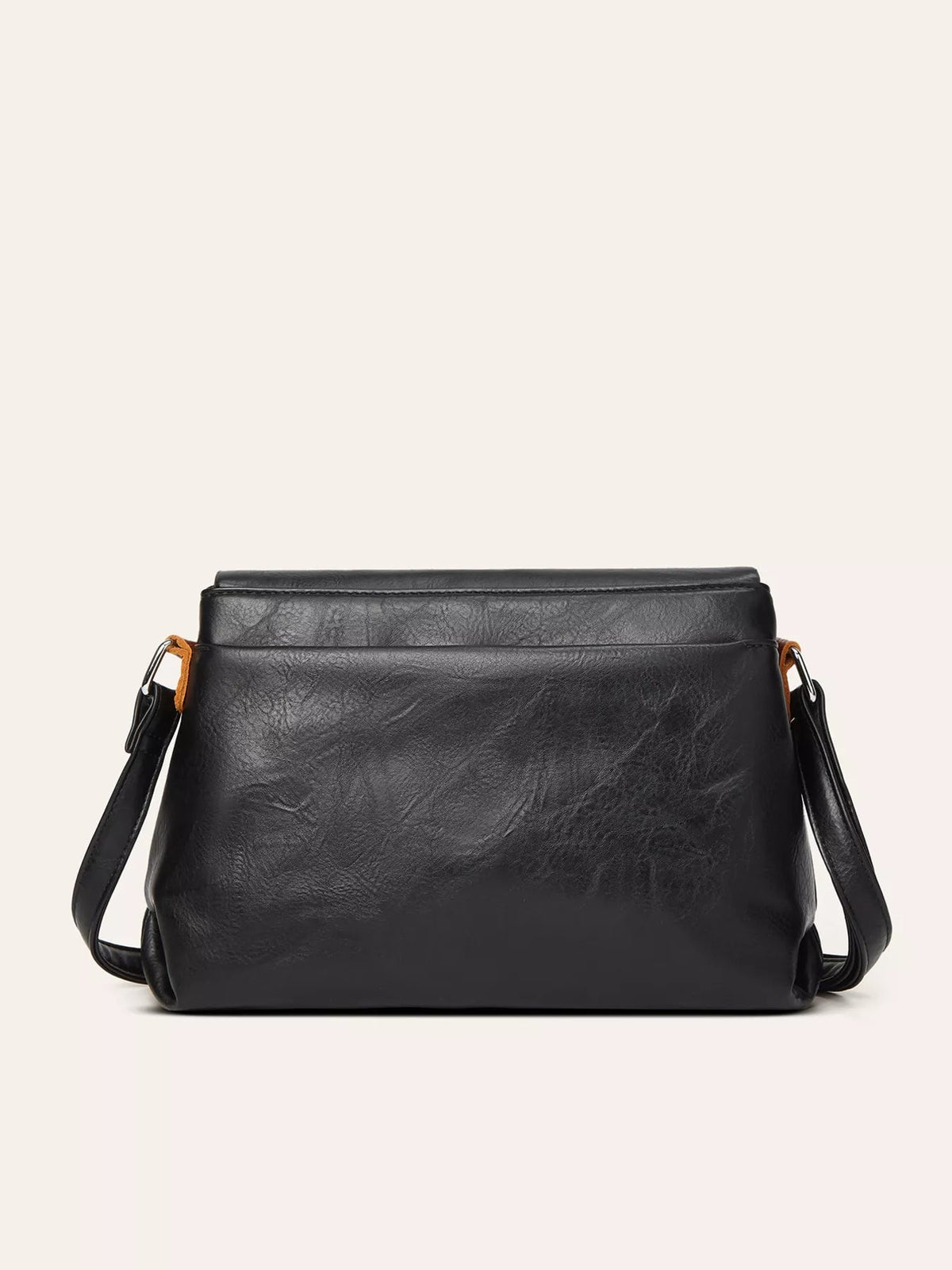 A medium black PU leather crossbody bag features a structured silhouette, wide flap closure, textured finish, and adjustable shoulder strap.