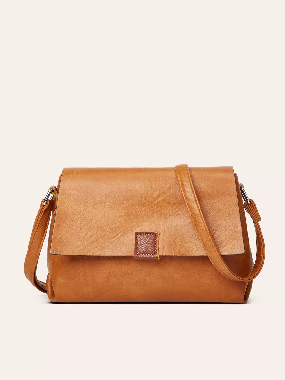 Medium vintage brown PU leather crossbody bag with a structured silhouette, oversized flap, central tab closure, and adjustable shoulder strap.