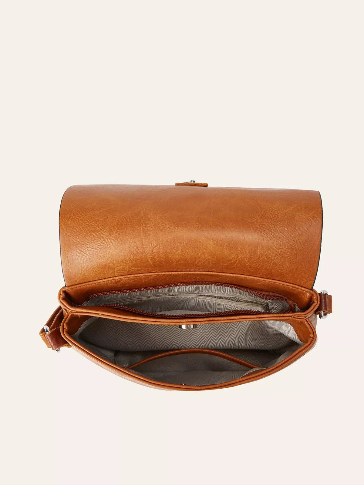 Open medium brown vintage PU leather flap crossbody bag showing multiple compartments, zippered sections, and patterned fabric lining.