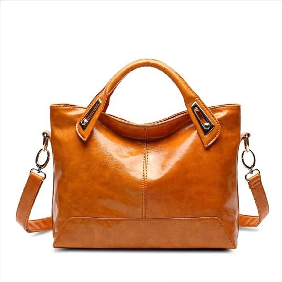 Vintage-style medium PU leather tote handbag in glossy cognac brown with dual top handles, a front pocket, center stitching, and an adjustable shoulder strap.