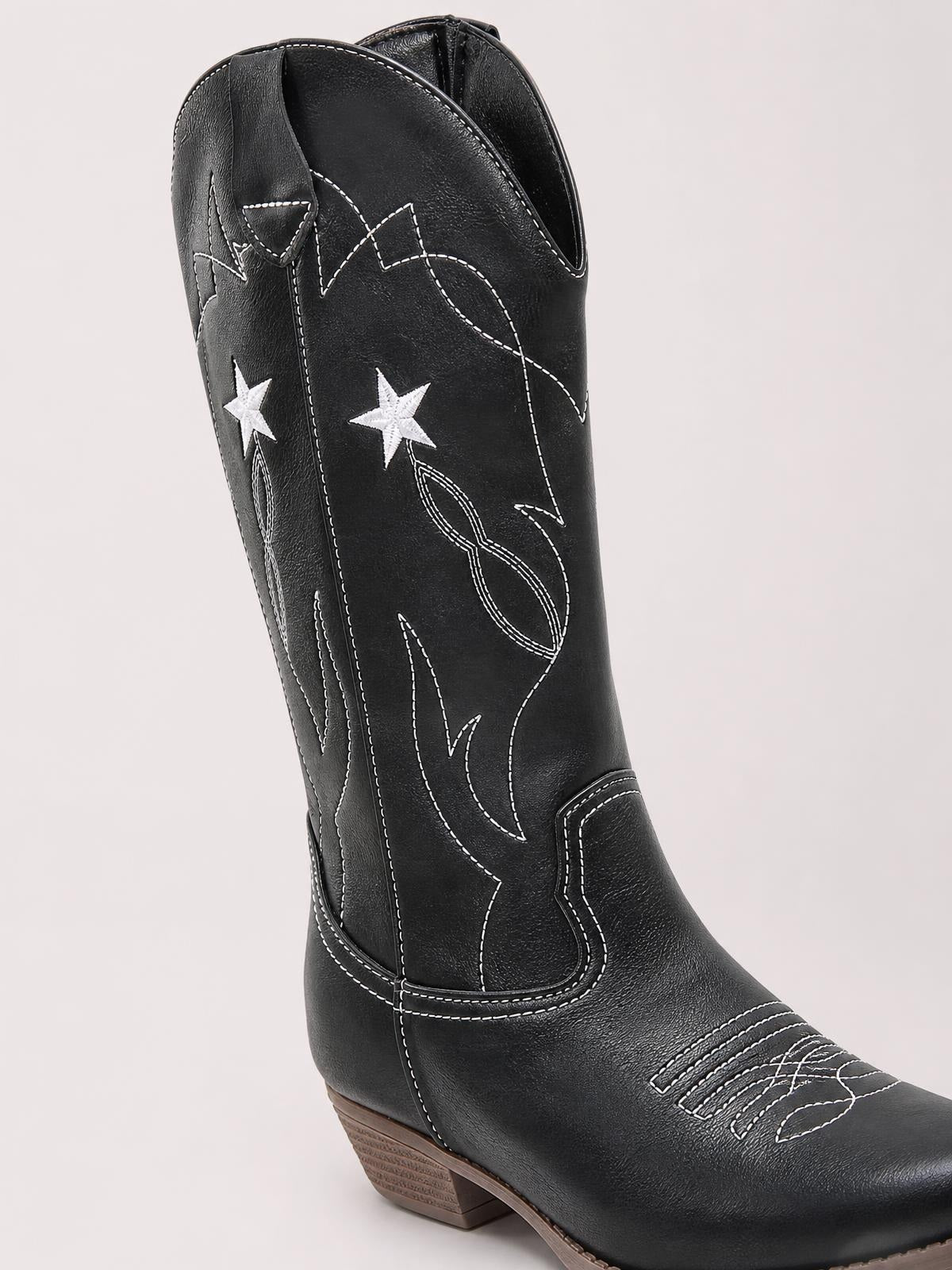 Black PU leather cowboy boot with white star embroidery, contrast stitching, tall shaft, pointed toe, pull tabs, and a low stacked heel.