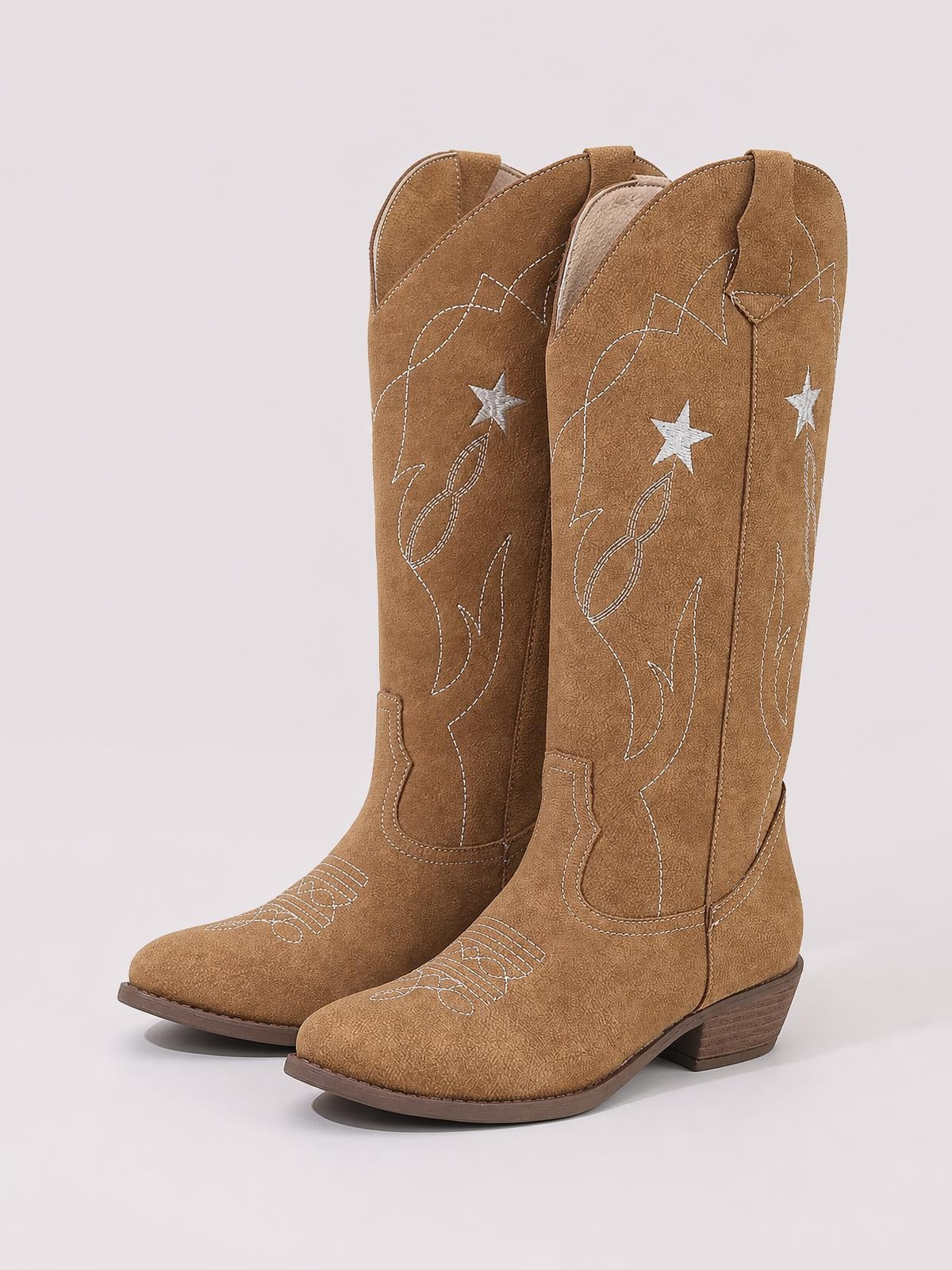 Brown Western Star cowboy boots with tall shafts, pointed toes, low stacked heels, and contrasting white star and decorative stitched embroidery.