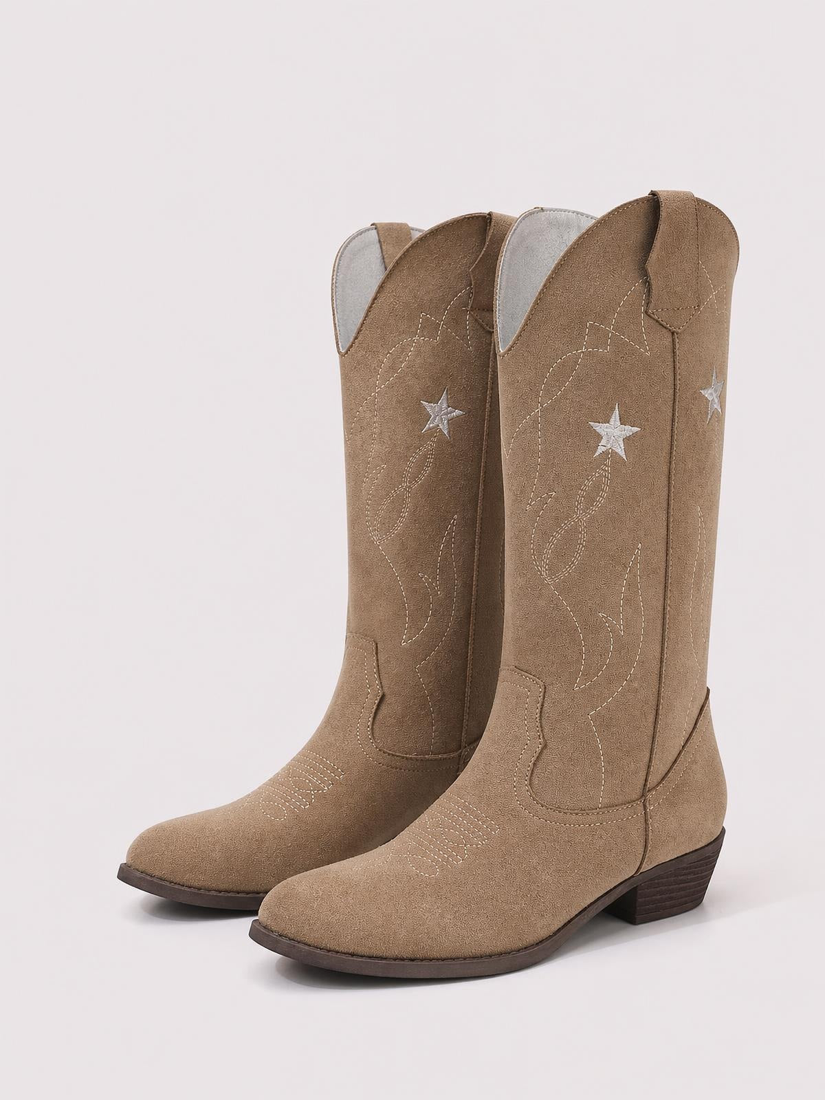 Tan PU leather cowboy boots with tall shafts, pointed toes, low stacked heels, pull tabs, and embroidered star and western stitching details.