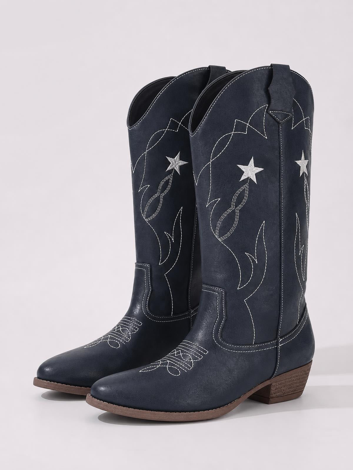 Dark navy Western Star cowboy boots feature tall shafts, white star embroidery and contrast stitching, pointed toes, pull tabs, and low stacked heels.