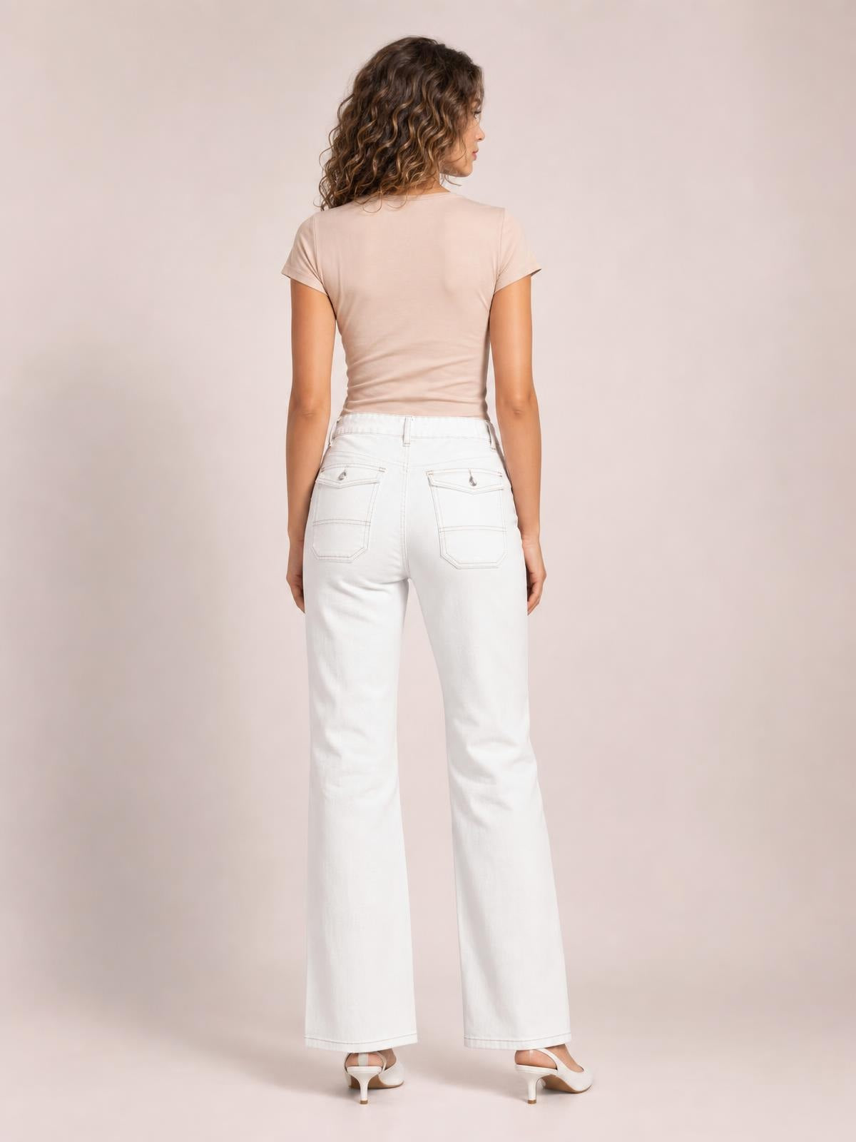 Model shown from behind wearing white wide-leg jeans with contrast stitching, back patch pockets, belt loops, and a high-rise silhouette.