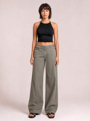 Model standing in gray wide-leg jeans with front and side pockets, a high-rise waistband, belt loops, zip fly, and relaxed full-length silhouette.