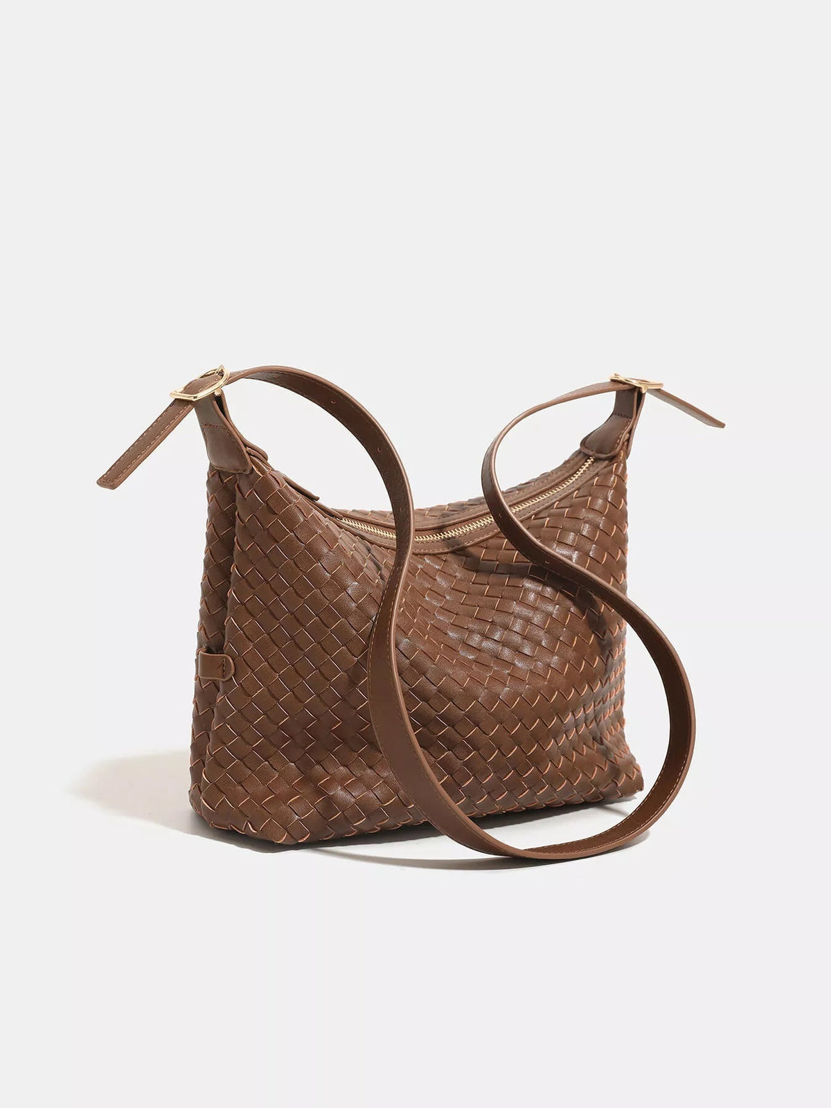 Medium brown woven PU leather shoulder bag with a roomy slouchy silhouette, textured basket weave, zip-top closure, and adjustable buckled straps.