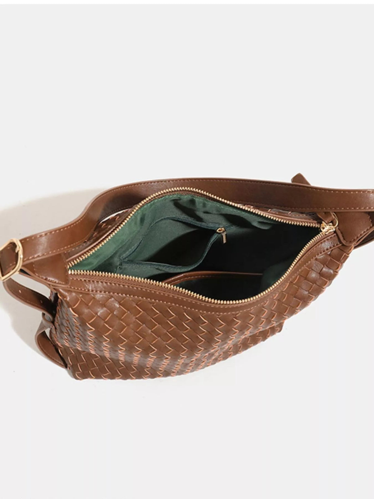 Medium brown woven PU leather shoulder bag shown open, featuring a spacious dark interior, zippered compartments, and a long shoulder strap.