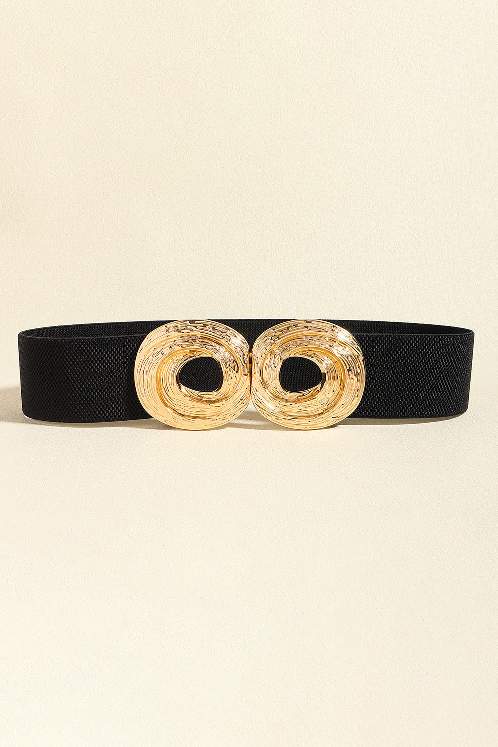 Black textured 2-inch statement belt featuring a polished gold-tone zinc alloy buckle with two sculptural circular rings.